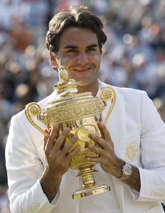 Switzerland's Roger Federer holds the trophy after winning his men's final match against Spain's Rafael Nadal at the Wimbledon tennis championships in London, July 8, 2007. 