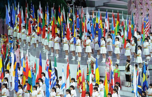 Flags of participants show up at Expo opening