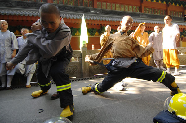 Monks test their firefighting skills