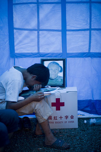 Family lost to landslide, boy is left with dog