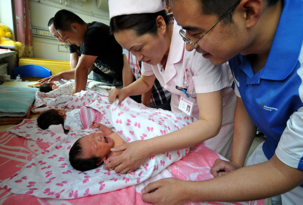 New fathers learn the ropes of the nursery