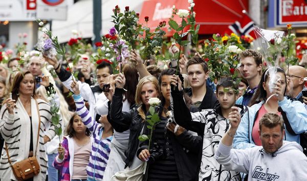 Sea of flowers marks vigil for twin attack victims