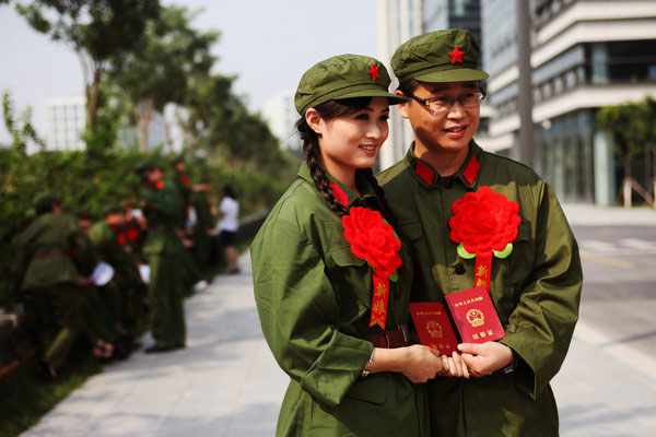 Couples marry in Red Army uniforms