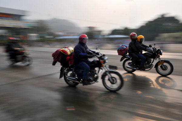 Annual mass motorbike migration revs home