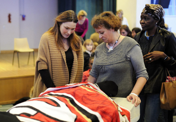 French First Lady Bruni visits disabled children