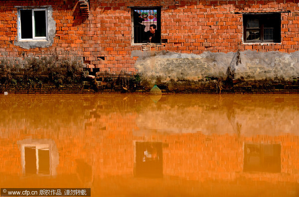 River turns orange due to spill