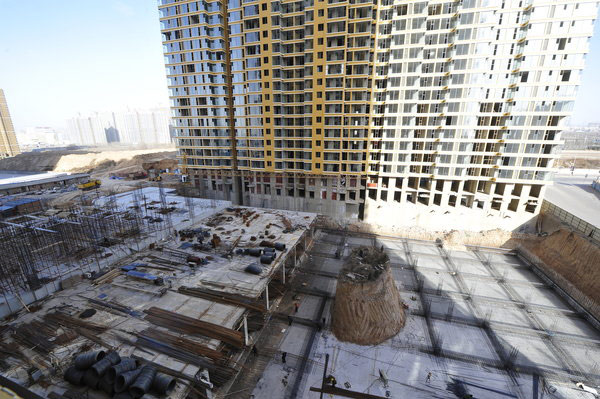 Mound of graves amid construction activity