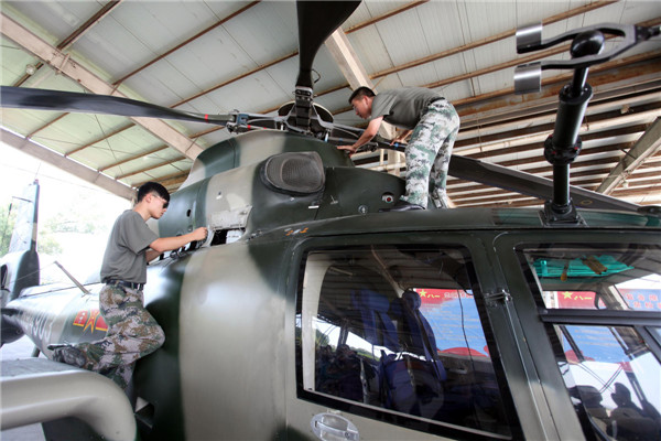 Helicopters practice acrobatic moves for expo