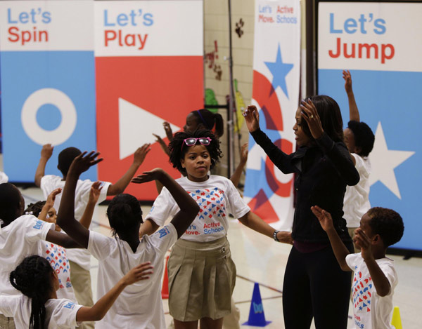 US First Lady joins O'Neal at back to school event