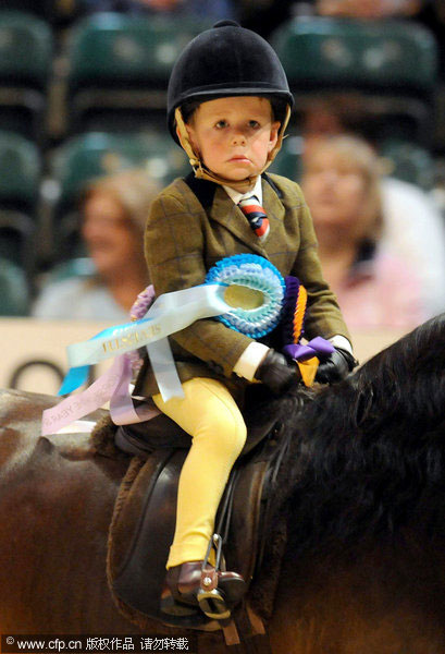 Harry, 3, rides into history books