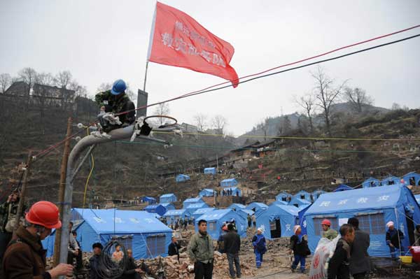 Relief work after fire in ancient village