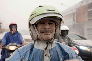 People clear volcanic ash in Indonesia