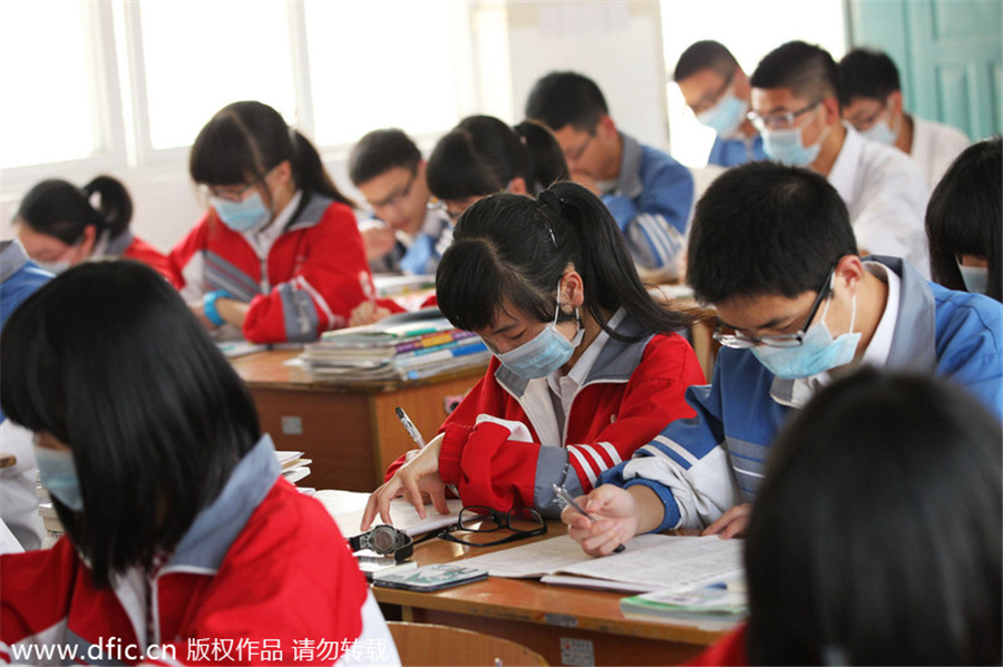 Mask-wearing students protest industrial waste gas