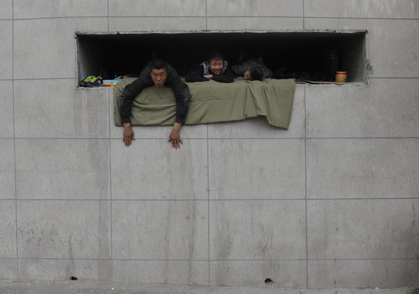 Street children live in hole in a wall in NE China