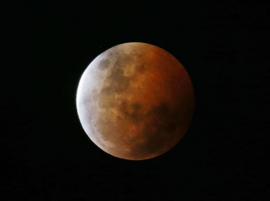 Lunar eclipse in Asia and the Americas