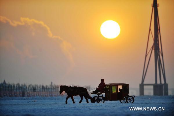 Tour on frozen Songhua River in NE China