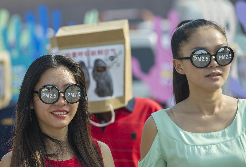 People take part in action art activity for environment protection in Chongqing