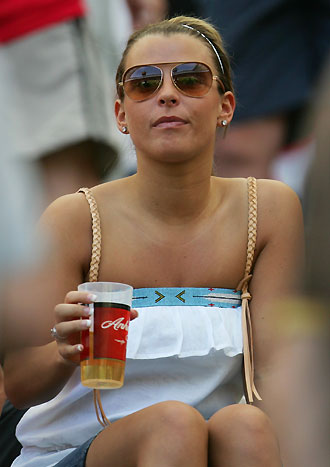 Wayne Rooney's fiancee Coleen McLoughlin waits in the stands before the start of the Group B World Cup 2006 soccer match between England and Paraguay in Frankfurt June 10, 2006. [Reuters]