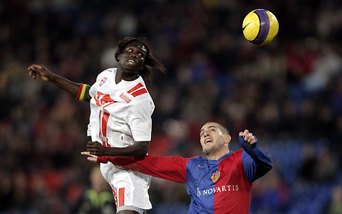 Basel's Mladen Petric (R) challenges AS Nancy's Papa Malichou Diakhate during their UEFA Cup Group E soccer match in Basel November 23, 2006. 