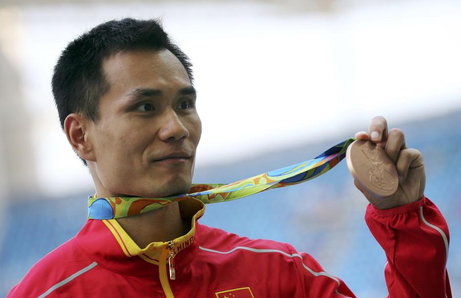 China's Dong Bin wins triple jump bronze