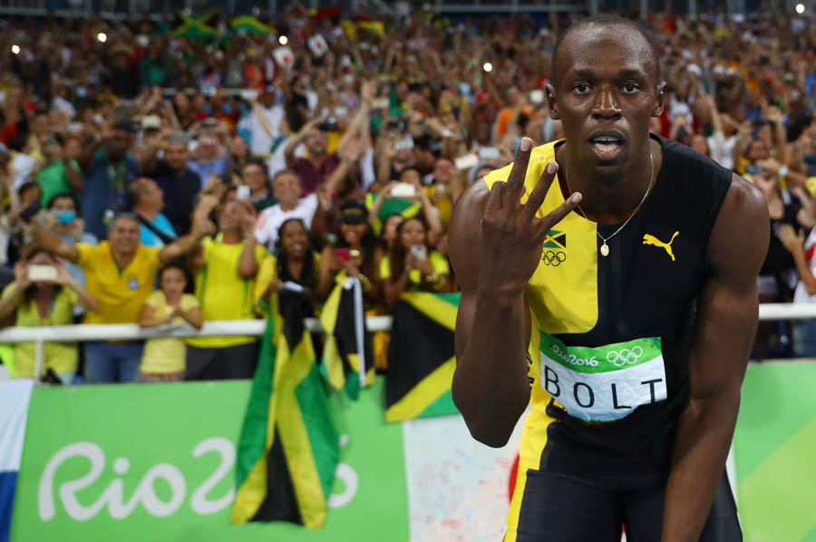 Usain Bolt accomplishes triple hat-trick