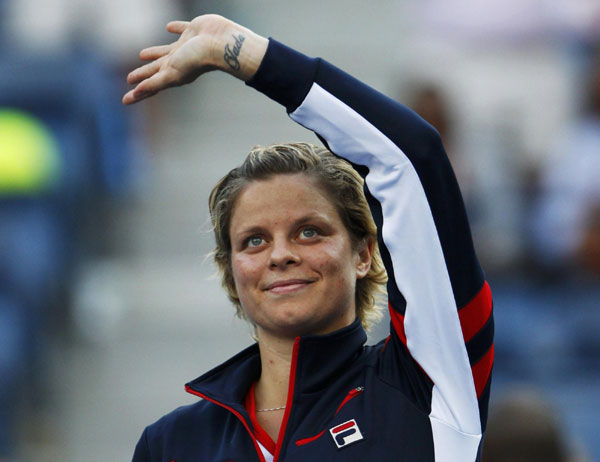 Clijsters exits as Azarenka, Ferrer cruise