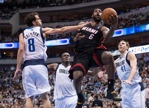 James scores 42, Heat pull away from Mavs 117-106