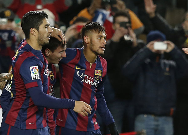 Barca fight back twice to stay in title race