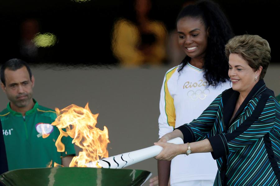 Olympic flame lands in Brazil for 94-day relay to Games