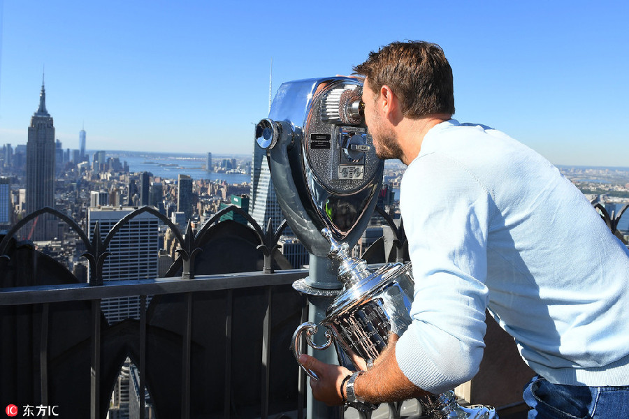 Wawrinka climbs 'top of the rock' for celebration