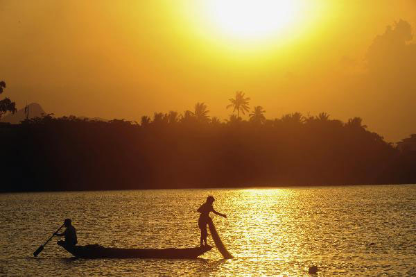 People fish in Wanquan River in Hainan