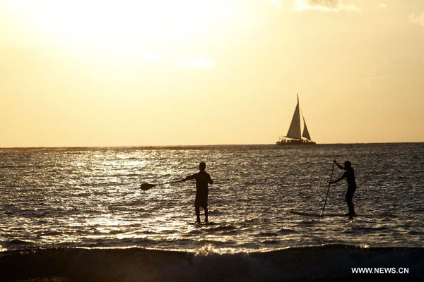 Tourists enjoy time on Tamarindo Beach in Costa Rica