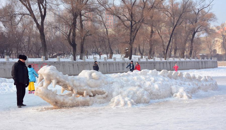 Giant crocodile sculpture made with snow