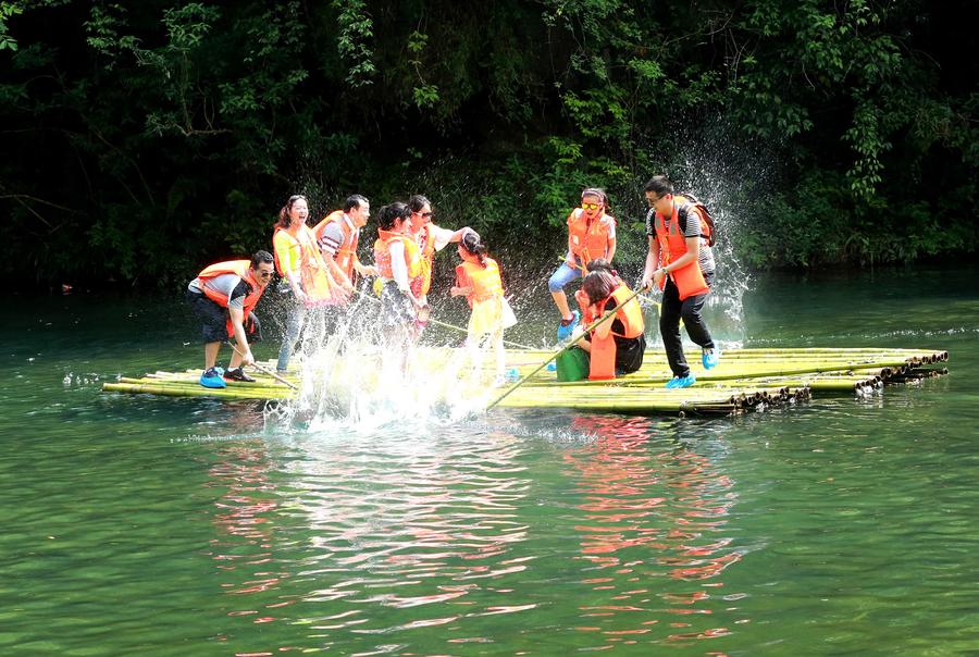 Tourists enjoy bamboo rafting in China's Hubei