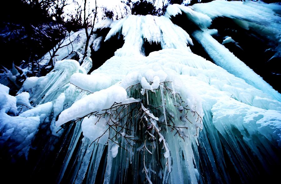 Scenery of icy waterfalls at Guanmen Mountain scenic spot in NE China