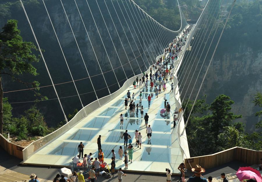 World's longest, highest glass bridge opens in Hunan