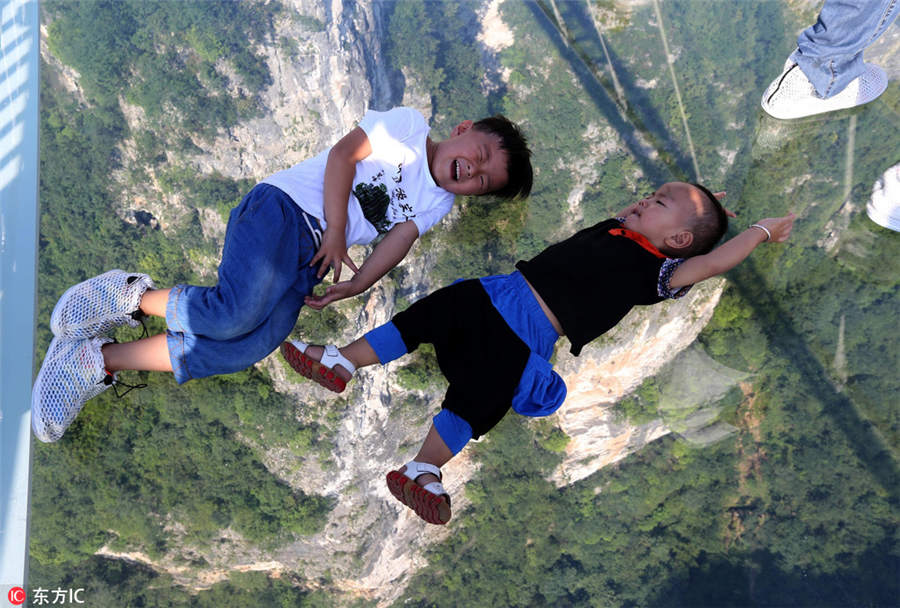 World's longest, highest glass bridge opens in Hunan