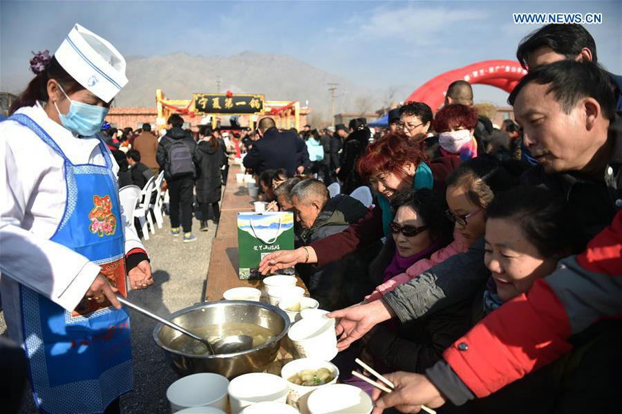 Cooks make lamb stew during food festival