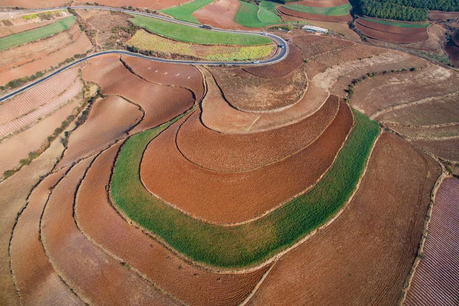 Scenery of red earth terraces in SW China's Kunming