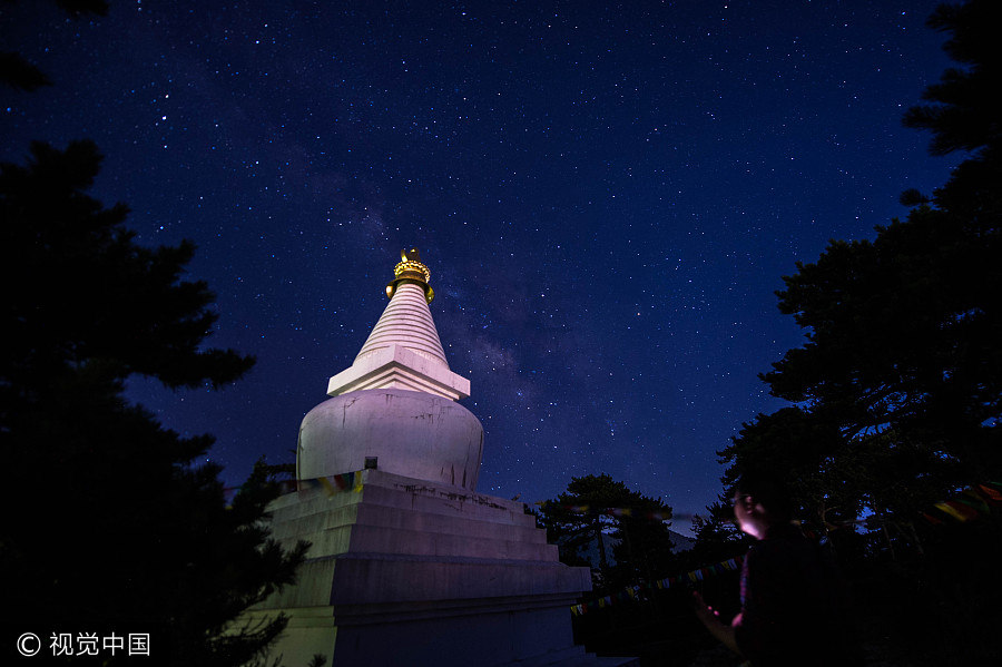 Milky Way illuminates night sky over small town in Jiangxi