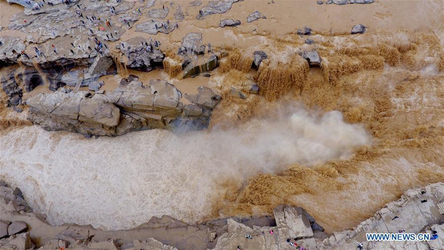 Water volume of Hukou Waterfall surges due to heavy rainfall