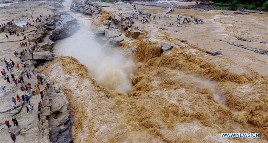 Water volume of Hukou Waterfall surges due to heavy rainfall