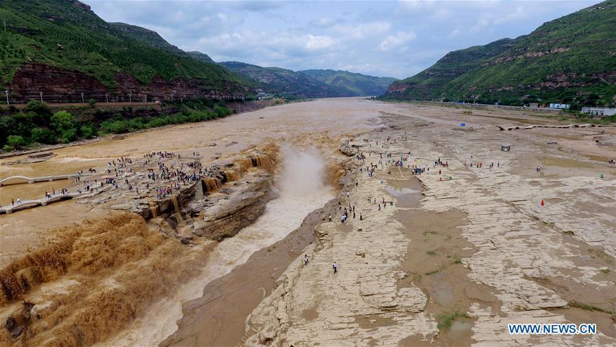 Water volume of Hukou Waterfall surges due to heavy rainfall