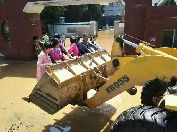 Loader ferries flood-stricken students