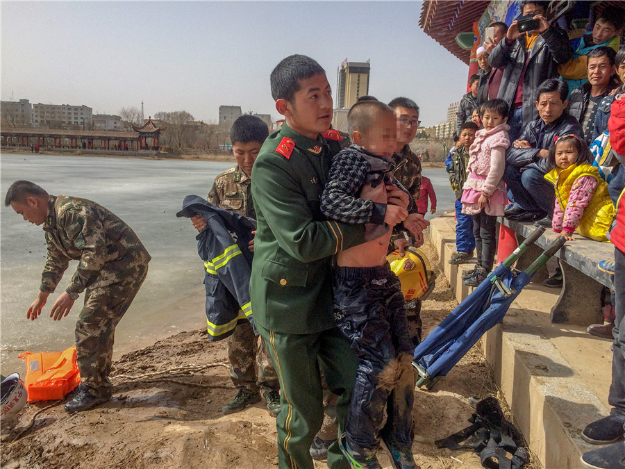 Firefighters rescue boys who fell through thin ice in NW China