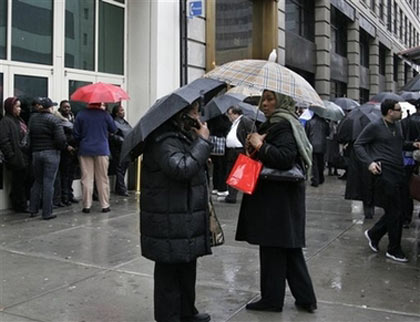 People stand outside of a building on West 34th Street in New York, Monday, Jan. 8, 2007. The people had chosen either to leave, or not enter, the building due to a gas odor. Authorities were investigating the source of a mysterious gas-like odor that wafted over a large part of Manhattan from Rockefeller Center through Greenwich Village. (AP Photo