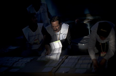 Workers start to count election votes in Afghanistan