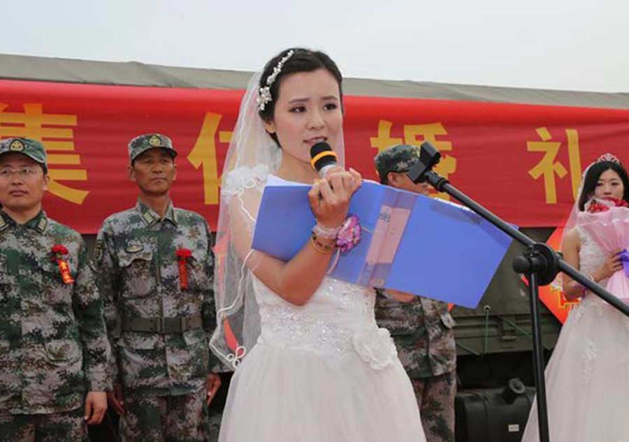 V-Day parade soldiers have group wedding