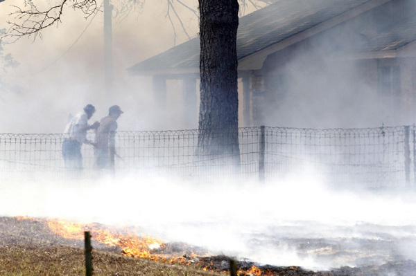 2 dead in Texas wildfires, homes destroyed