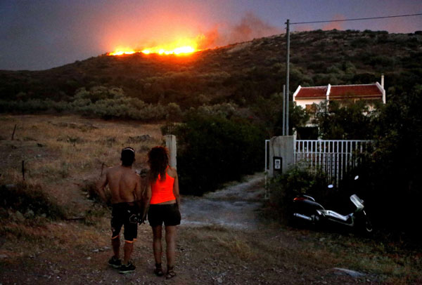 Greece battles wildfires upon general polls